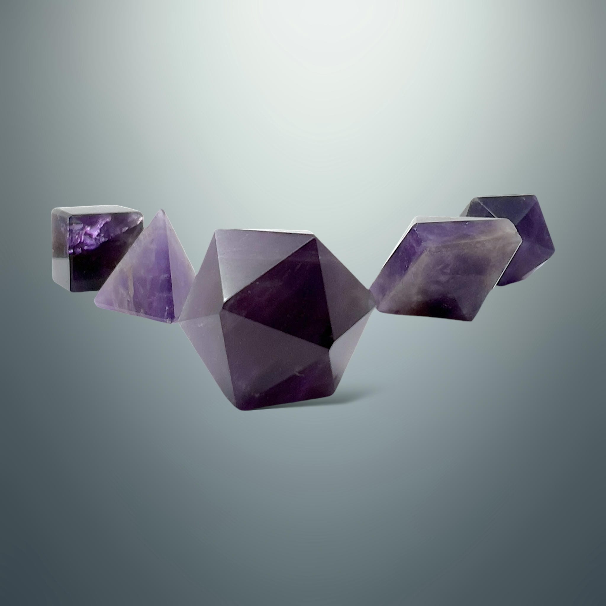 Set de Sólidos Platónicos en Amatista (Caja de Madera)